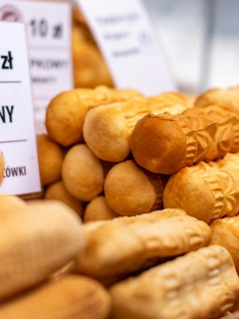 Delicious traditional smoked Oscypki cheese on display in Zakopane market, Poland.