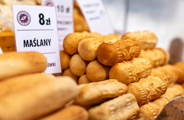 Delicious traditional smoked Oscypki cheese on display in Zakopane market, Poland.