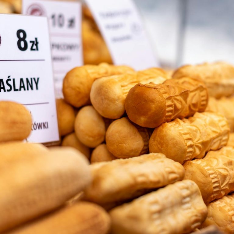 Delicious traditional smoked Oscypki cheese on display in Zakopane market, Poland.