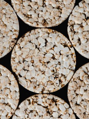 Top view of round rice cakes showcasing texture and pattern. Ideal for food-related themes.
