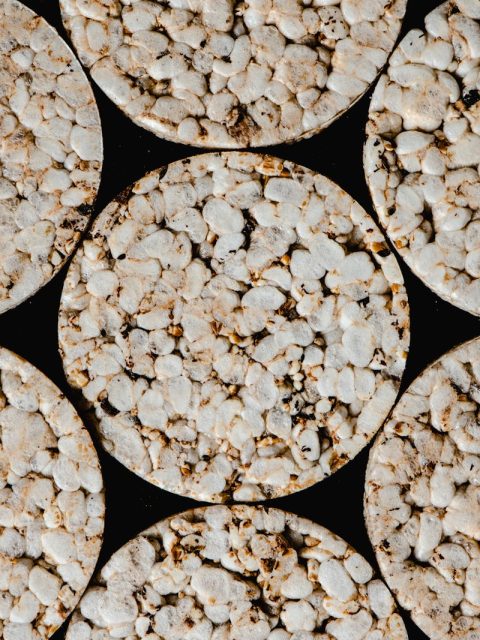 Top view of round rice cakes showcasing texture and pattern. Ideal for food-related themes.
