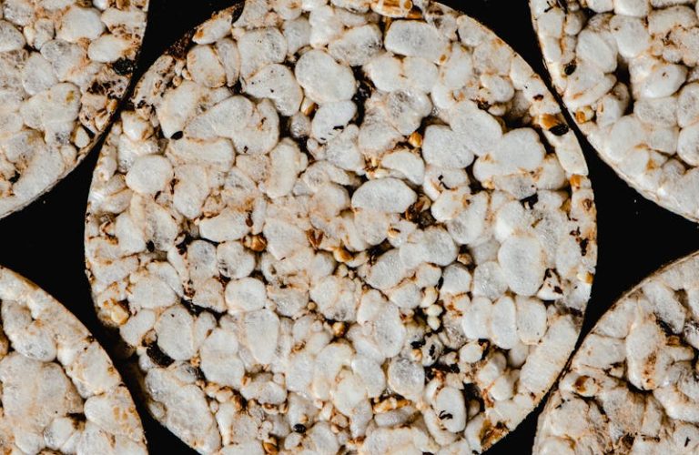 Top view of round rice cakes showcasing texture and pattern. Ideal for food-related themes.